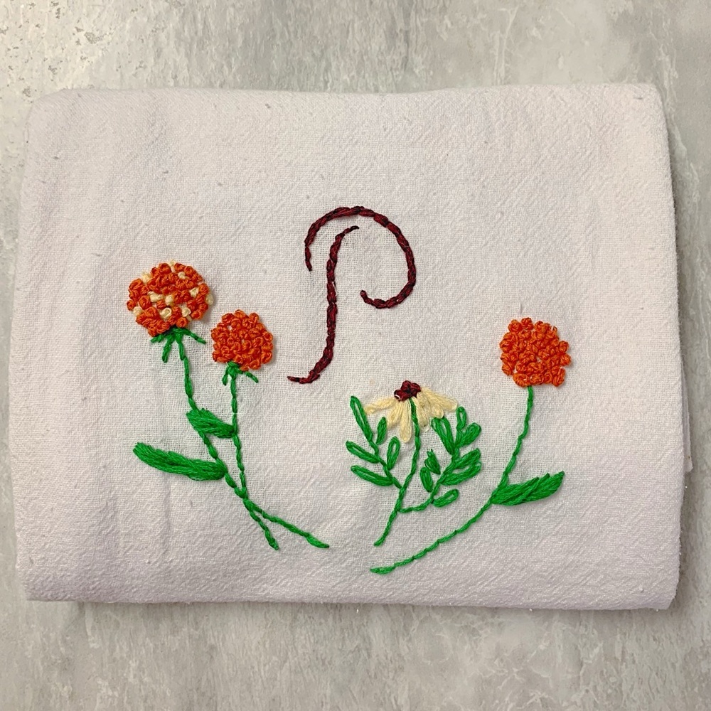Embroidered monogram hand towel.